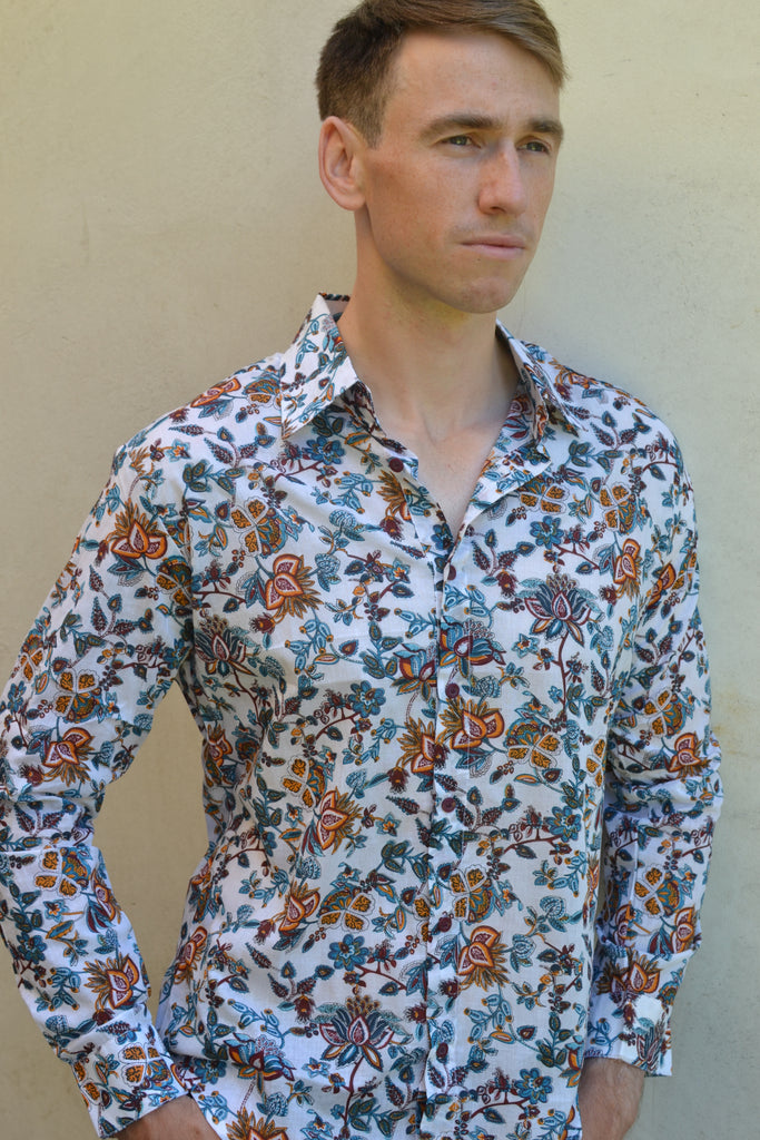 White with turquiose floral long sleeve shirt.